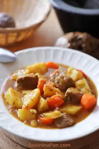 Spanish potato with veal stew in a plate.