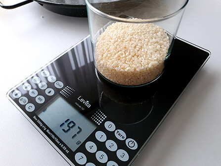 Weighing rice for a paella.
