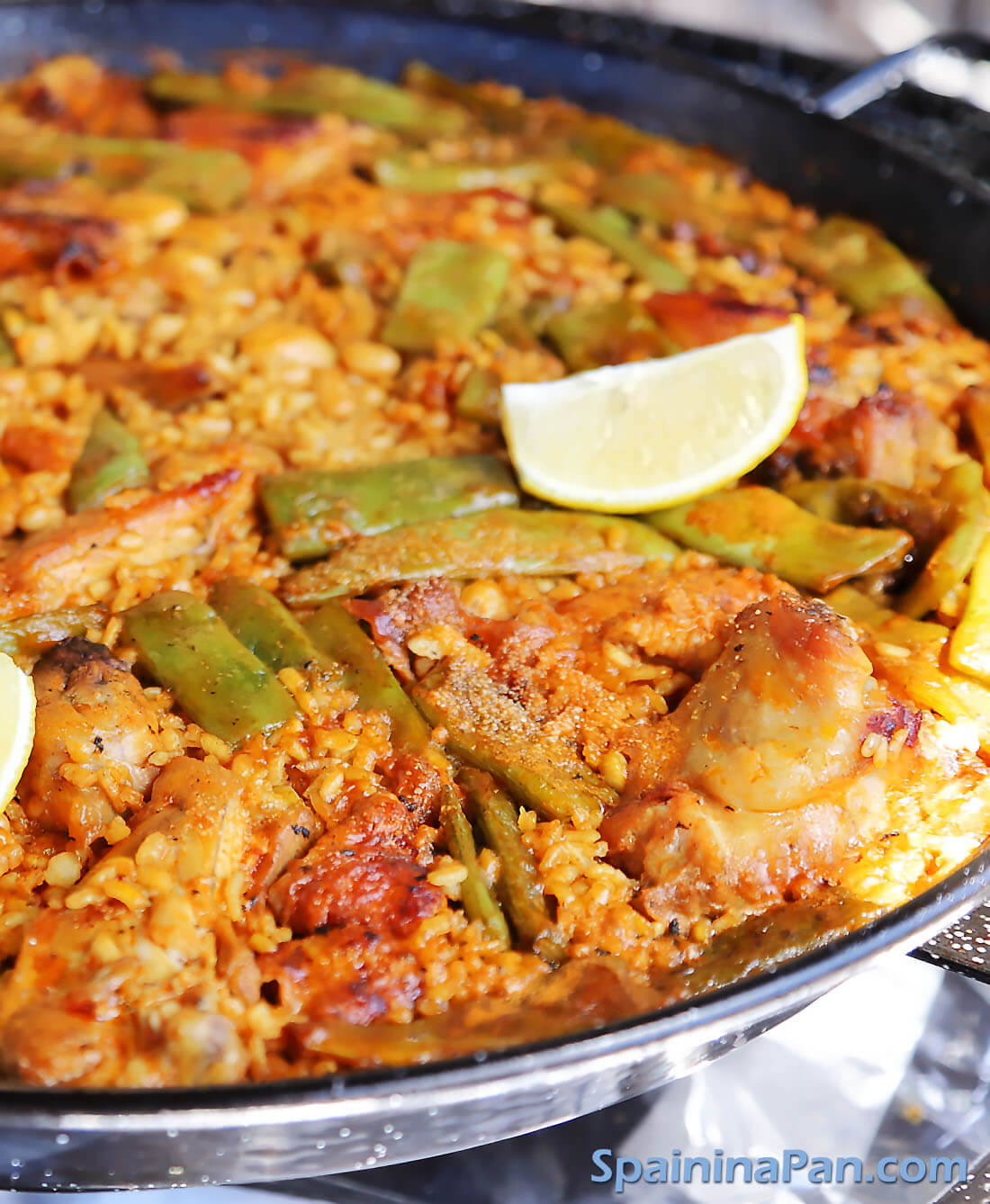Authentic Spanish paella Valenciana in a pan.