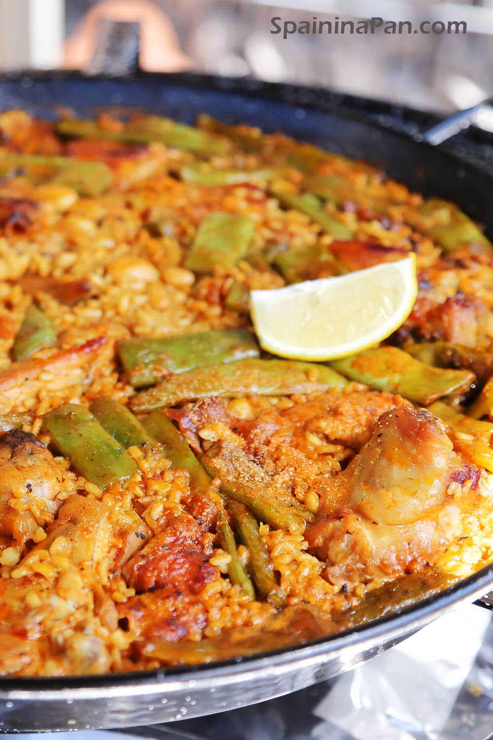 Authentic paella Valenciana in a paella pan.