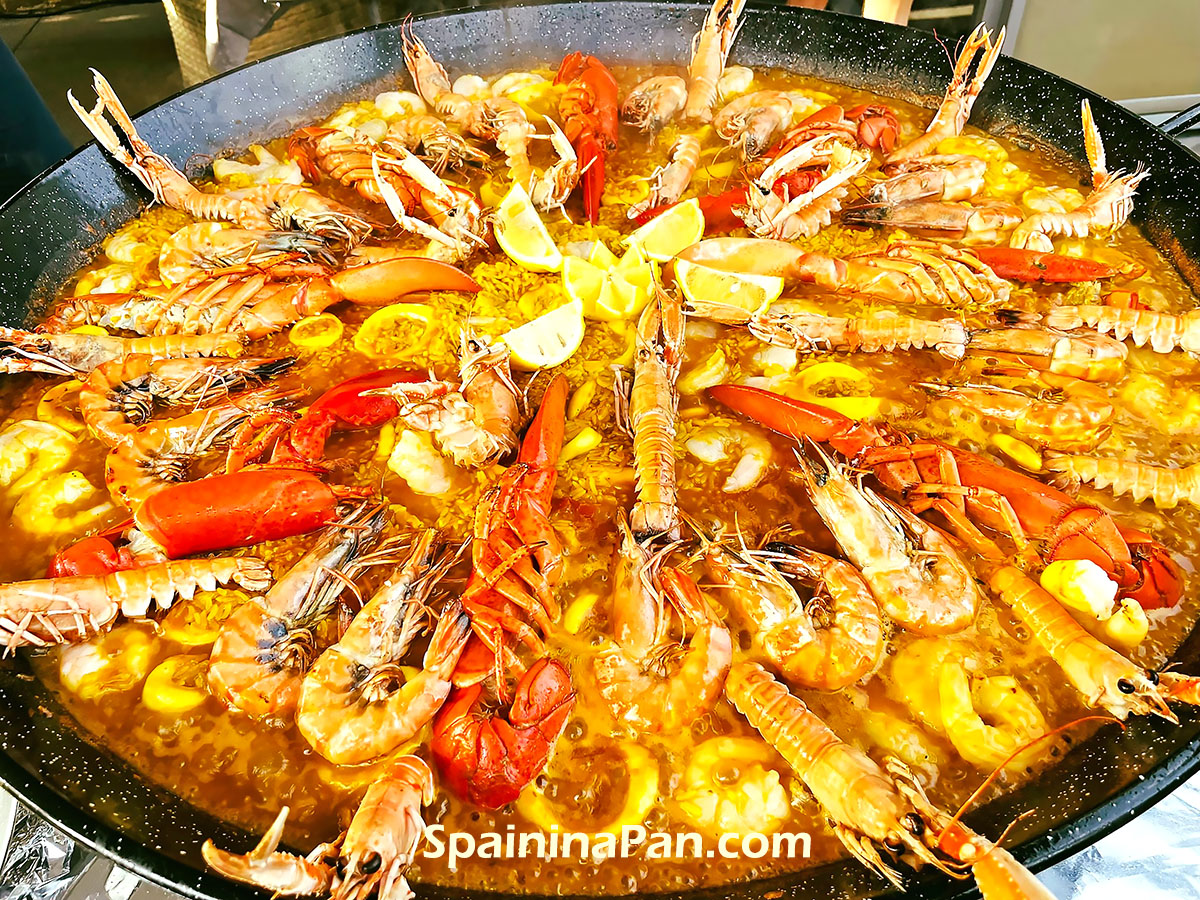 Appetizing lobster paella in a pan