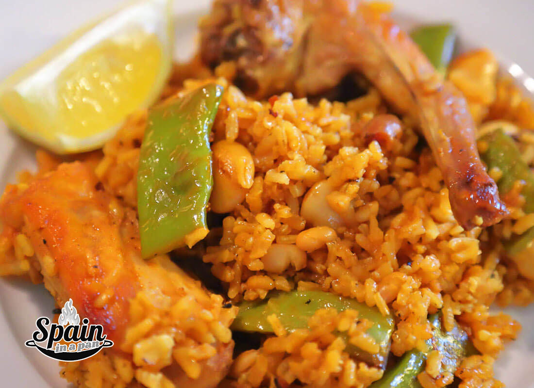 Authentic Spanish paella Valenciana on a dish.