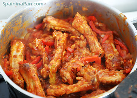 Spanish potato and ribs stew in a pan. Spanish potato and ribs stew in a pan.