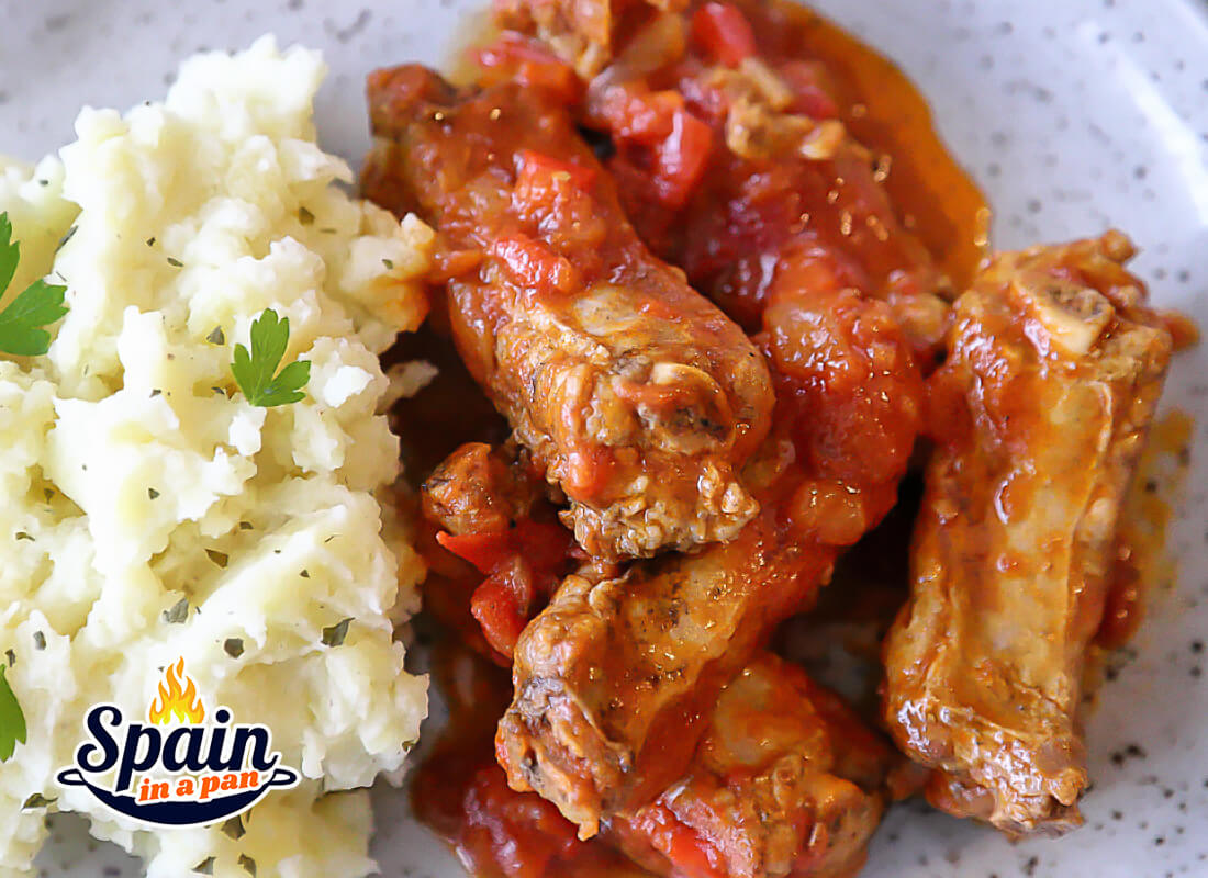Spanish pork ribs in tomato sauce with mashed potatoes.