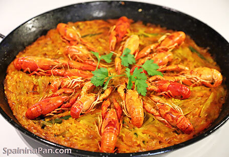 Spanish crayfish paella in a pan.