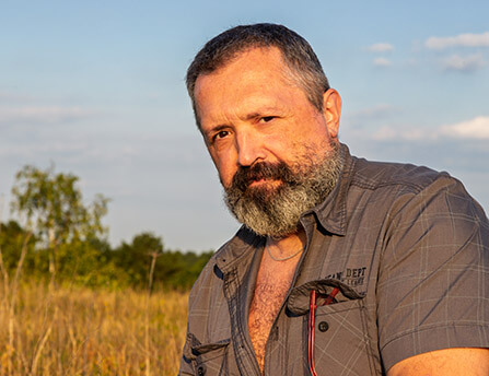 Chef Edu Valor outdoors in the sunset.