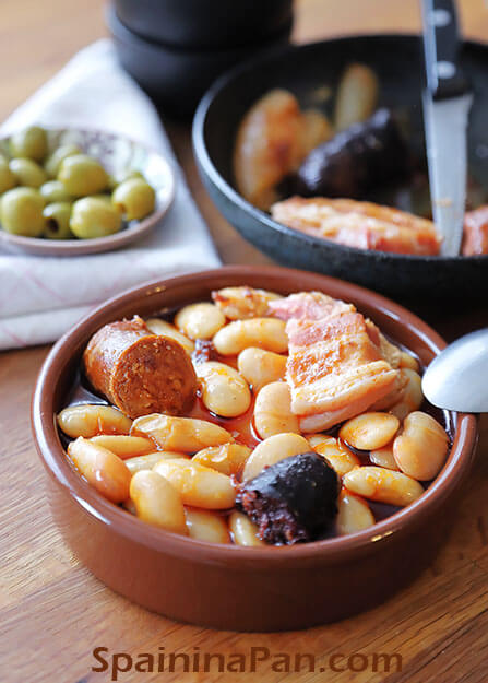 Fabada asturiana bean stew in a cazuela.
