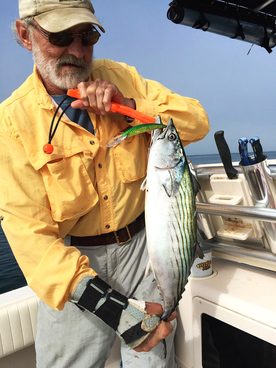 Fisherman with tuna on a boat. Fisherman with tuna on a boat.