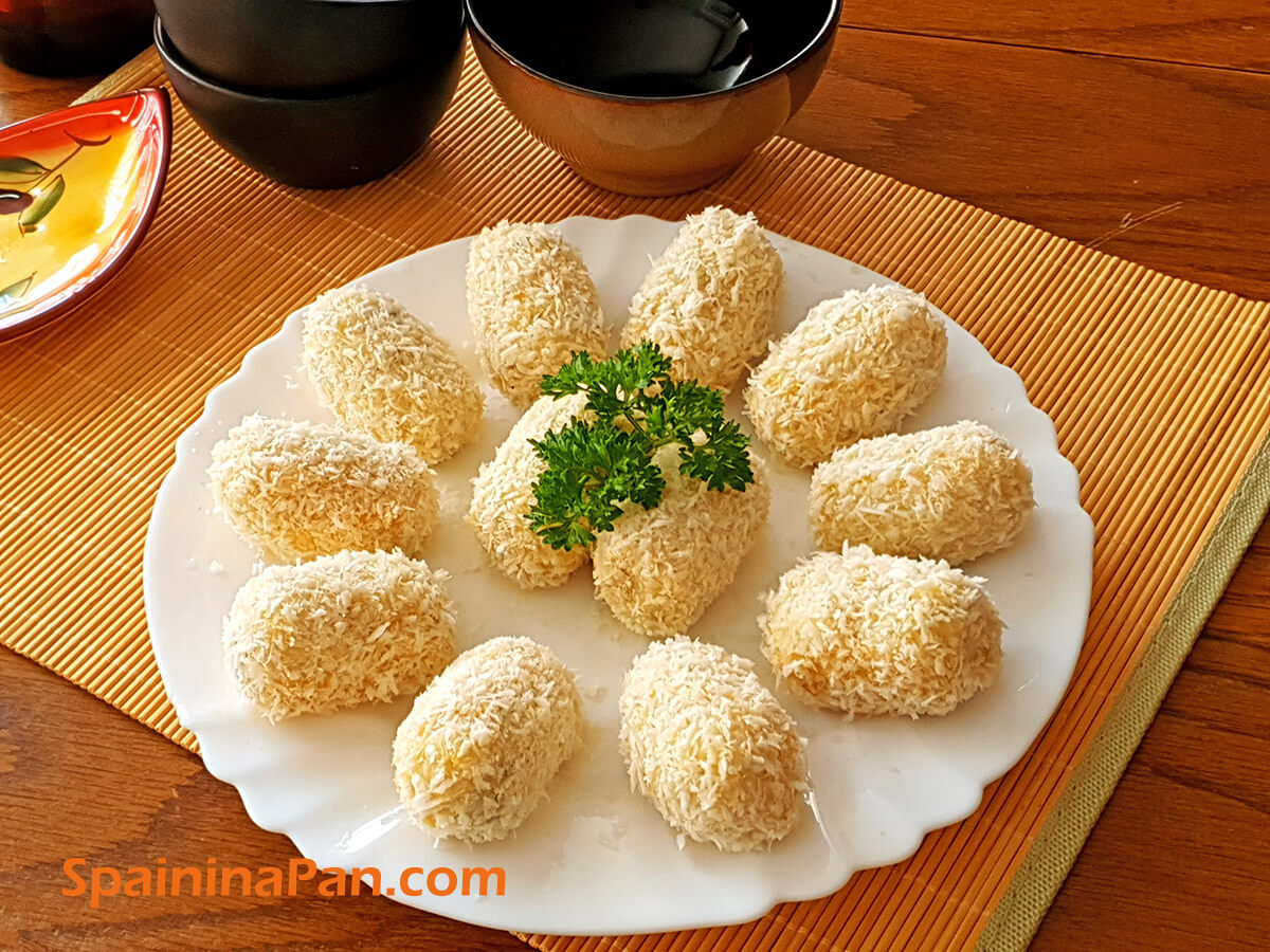 Fresh made Spanish cod croquettes on a plate.