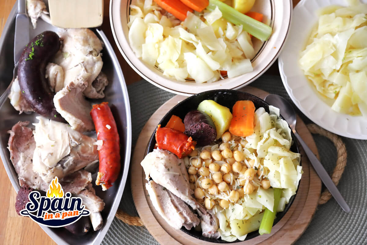 An appetizing Madrilenian cocido stew in three courses on a table.