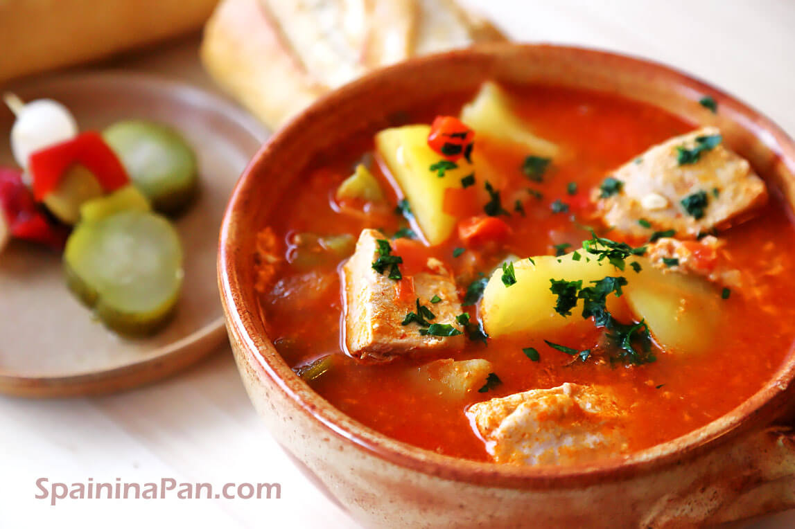 Marmitako Spanish tuna potato stew in a bowl with bread