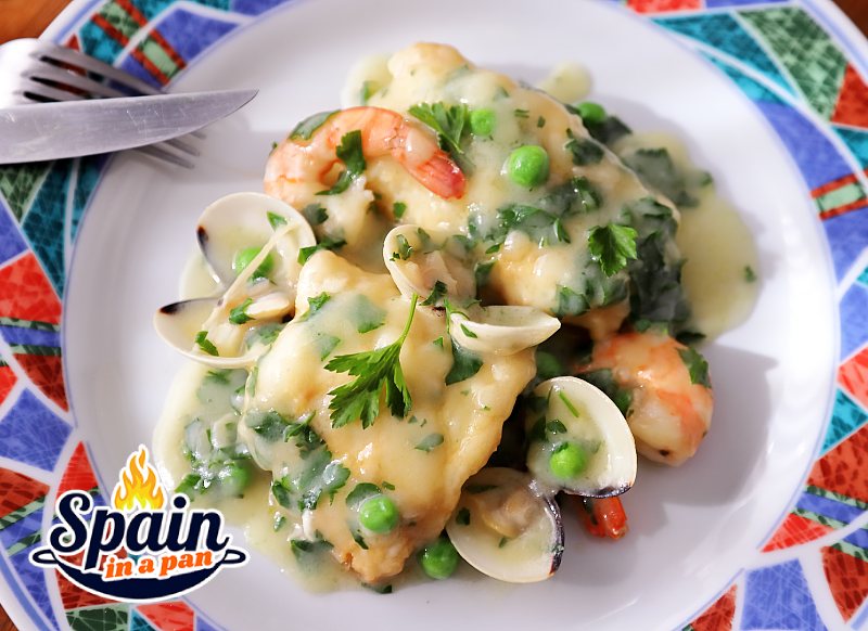 Spanish currito monkfish with sauce on a decorative plate.