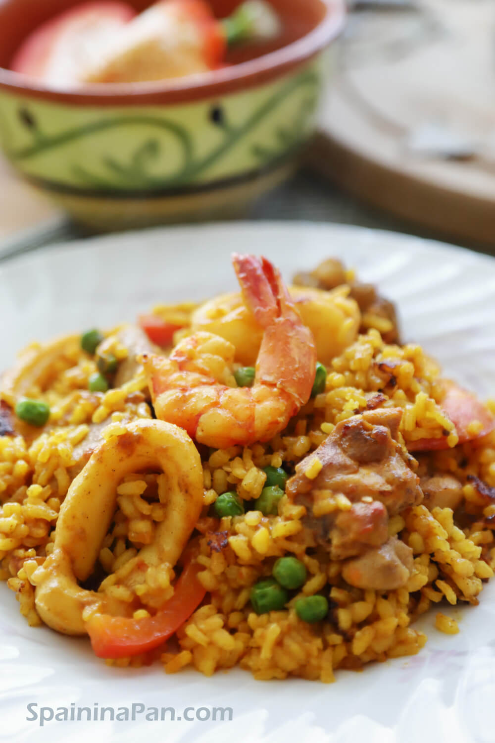 Tasty mixed paella or paella mixta on a plate.