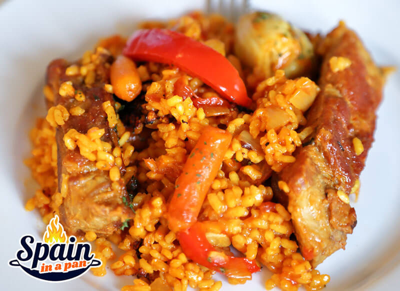 Pork ribs paella on a plate.