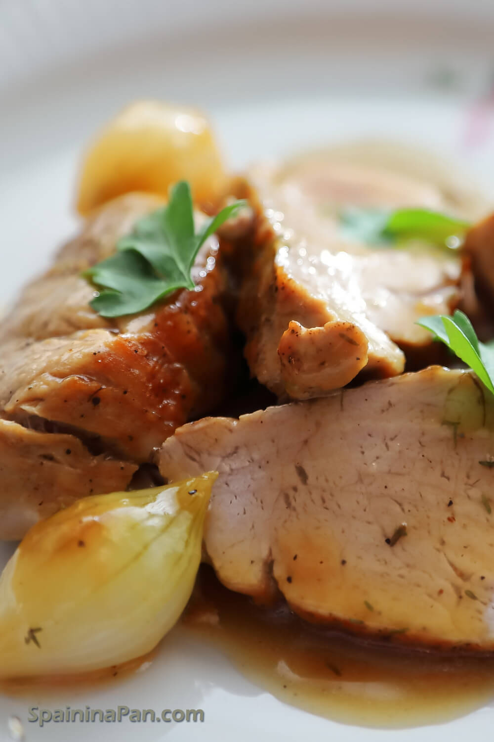 Spanish tenderloin in sherry sauce on a decorative plate.