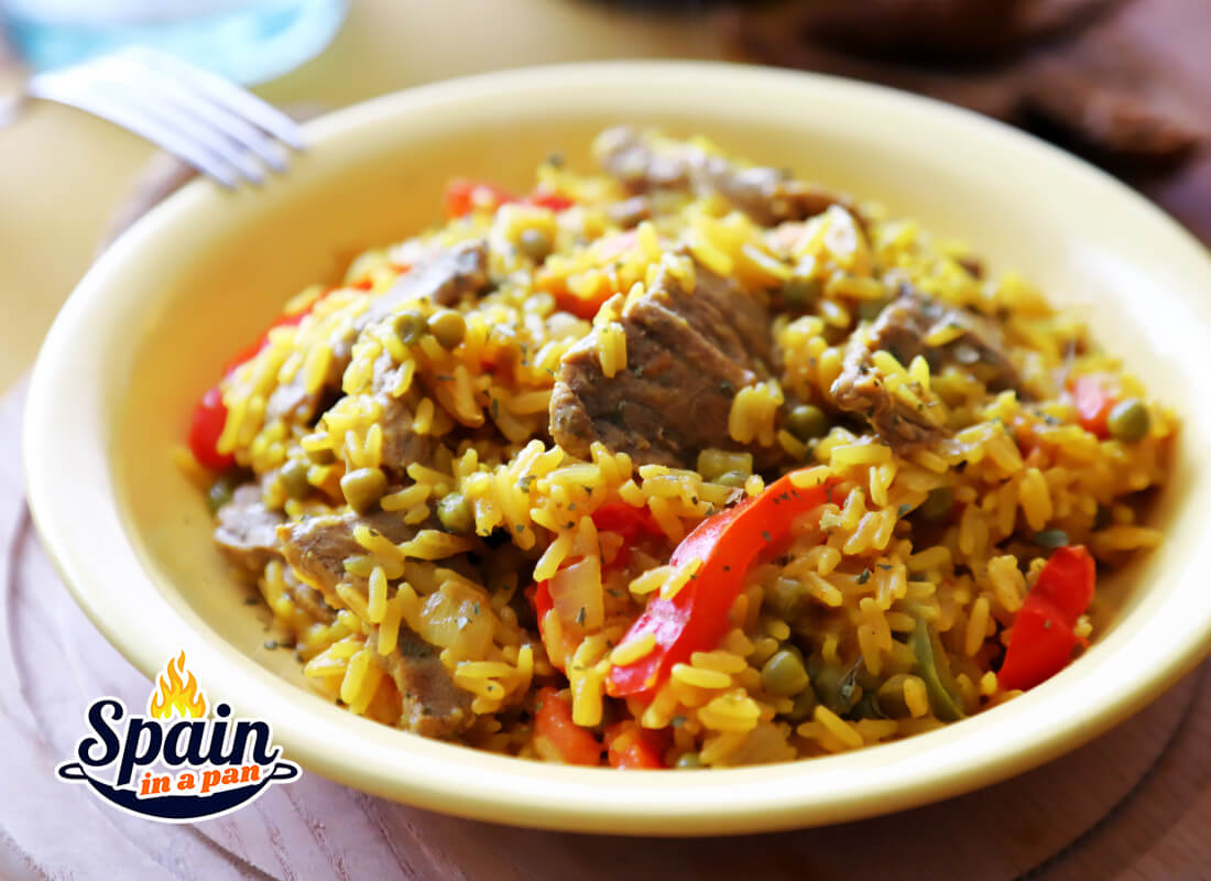 Spanish beef rice in a yellow plate.