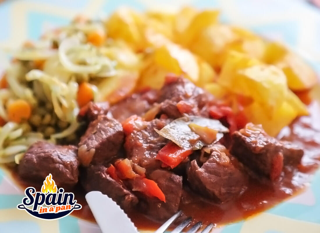 Spanish beef stew with pimiento with fried potatoes.
