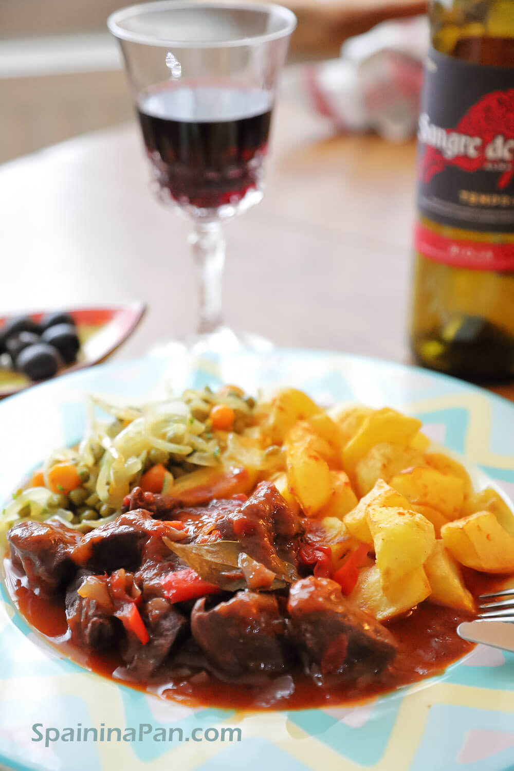 Spanish beef stew with pimiento with fried potatoes. Spanish beef stew with pimiento with fried potatoes.