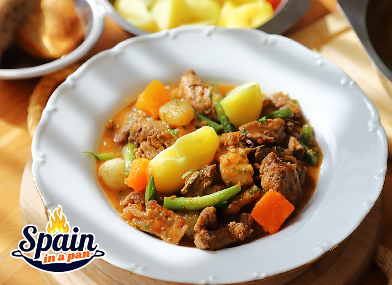 Spanish beef with pumpkin stew in a deep plate.