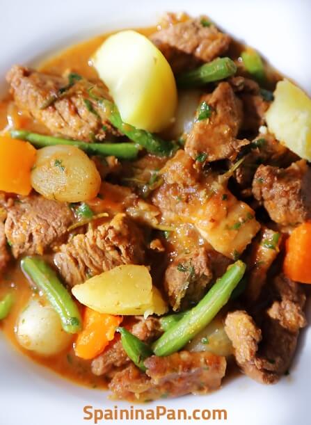 Spanish beef with pumpkin stew in a deep plate.