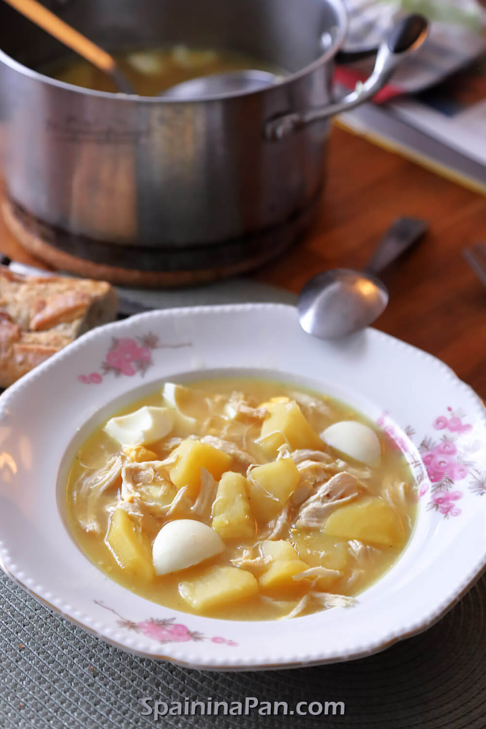 Spanish chicken and eggs soup with bread.