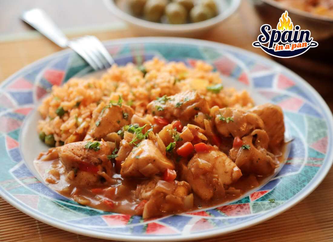 Spanish chicken in orange sauce on a plate. Spanish chicken in orange sauce on a plate.