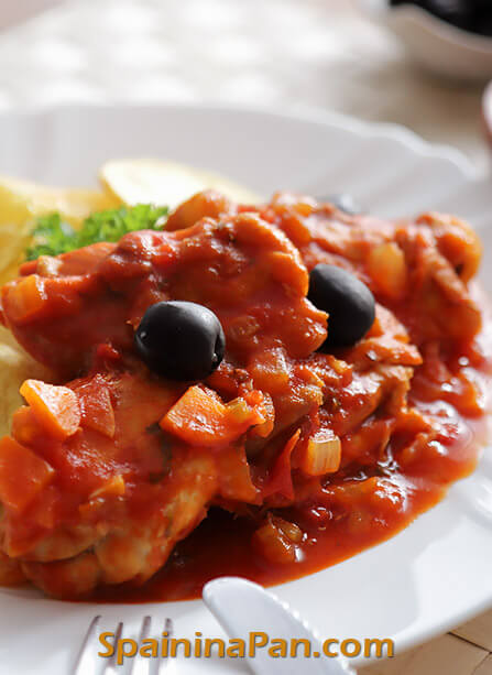 Spanish chicken in tomato sauce on a plate.