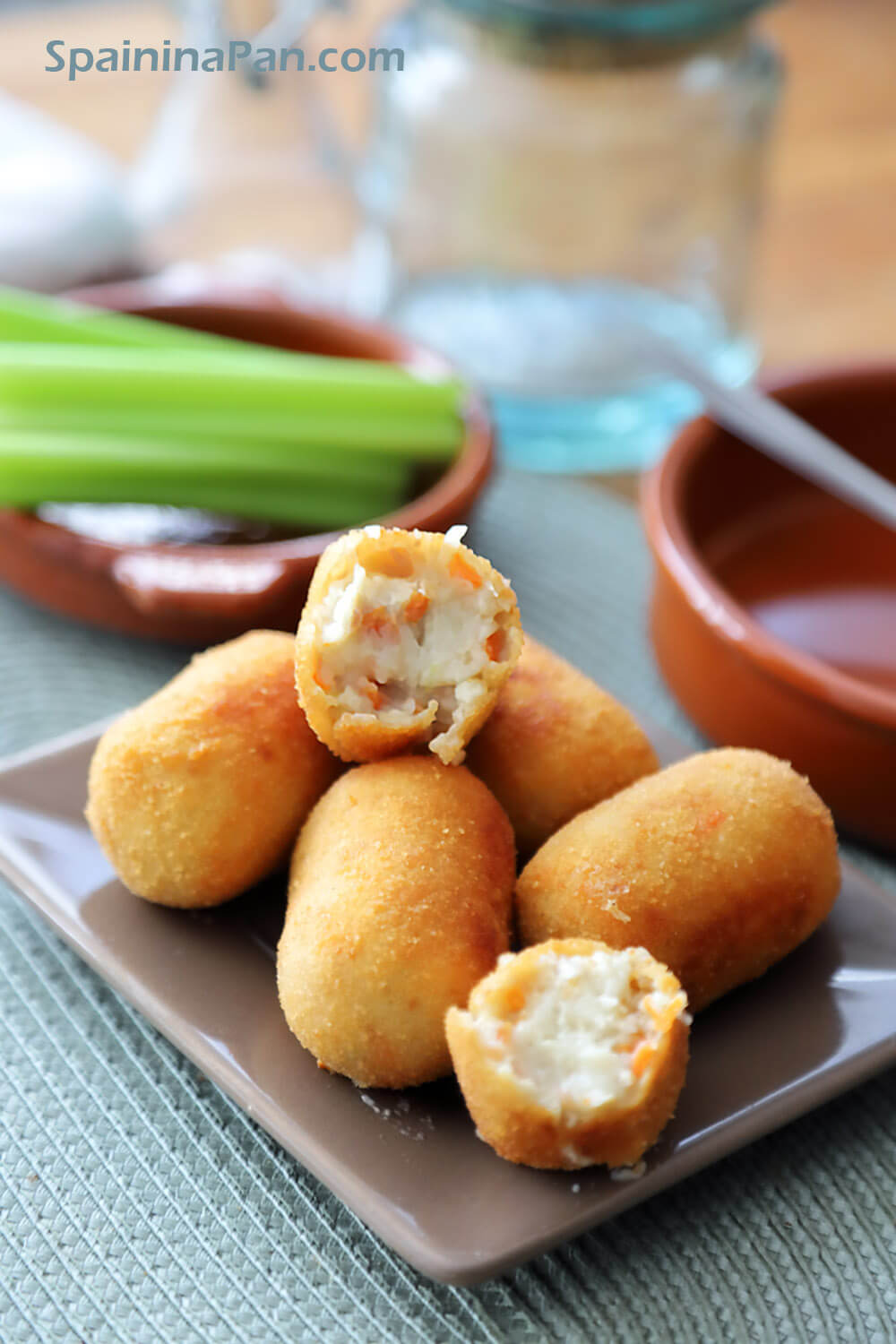 Appetizing Spanish cocido stew croquettes on a saucer.