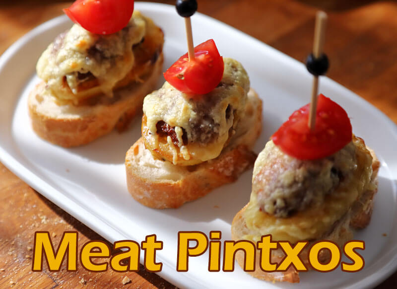 Spanish meat pinchos on a plate.