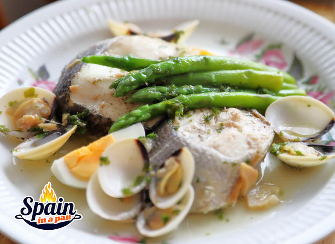 Spanish hake with eggs stew on a plate.