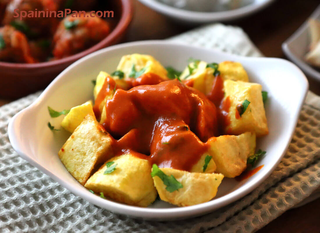 Spanish patatas bravas without tomato in a tray.