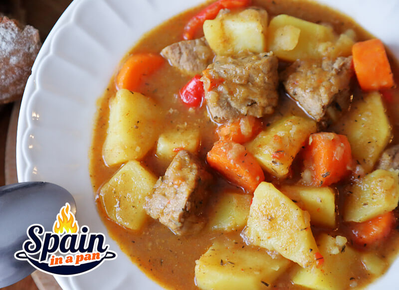 Spanish potato with veal stew in a plate.