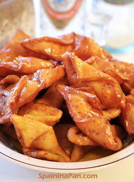 Spanish honey pestiños pastry in a bowl.