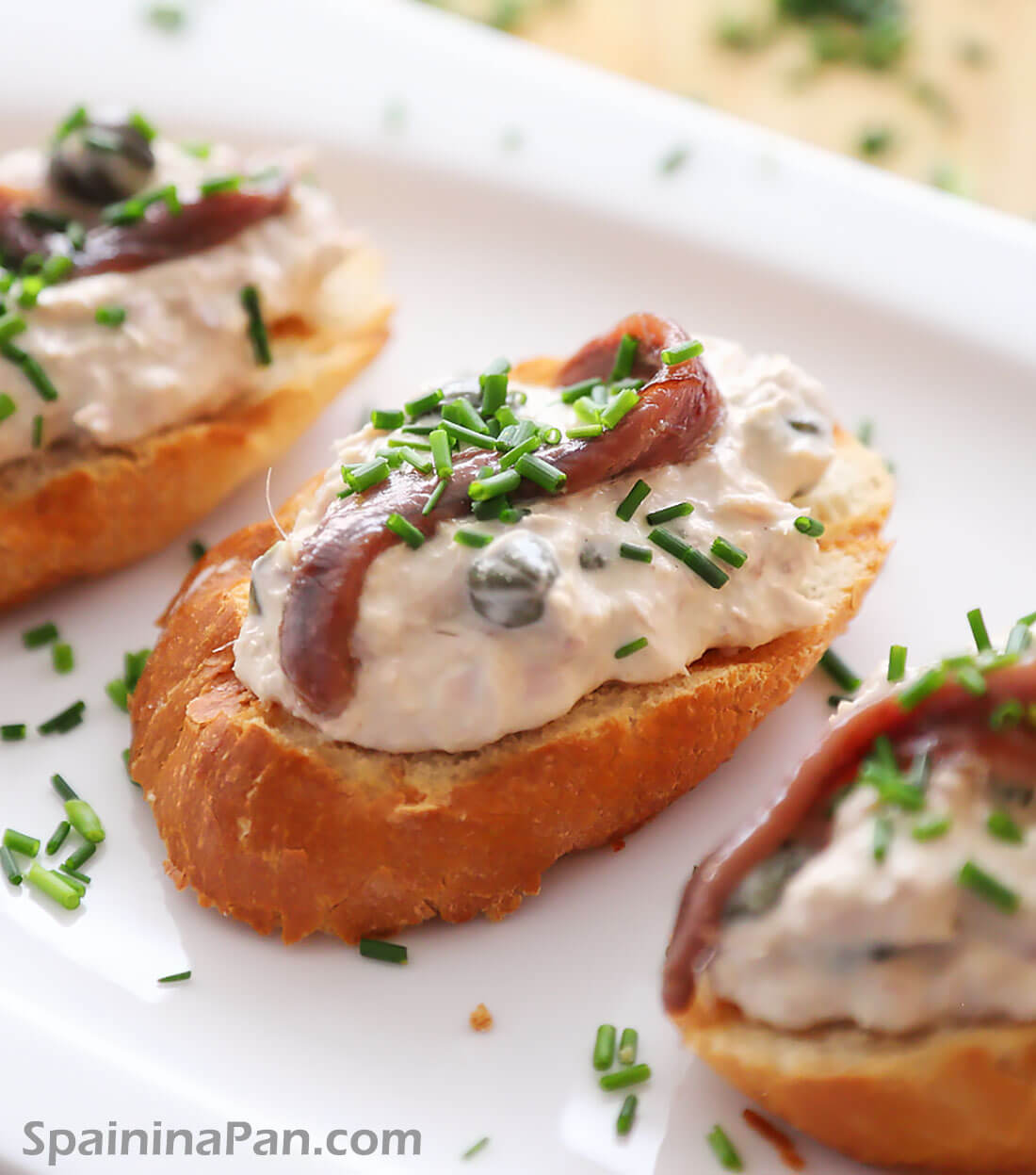 Tuna pintxos with anchovies on a ceramic tray