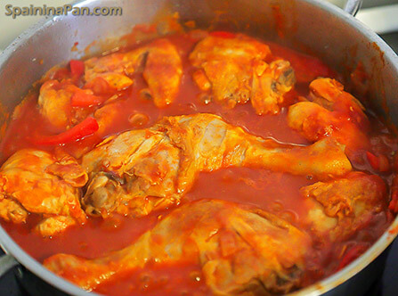 Spanish pollo al chilindron chicken in a pan.