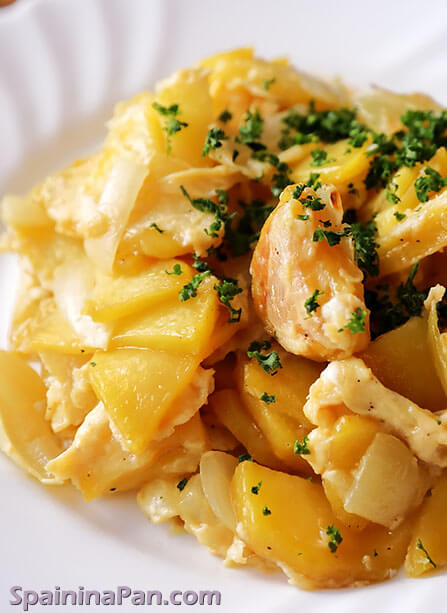 Spanish scrambled potatoes garnished with parsley on a ceramic plate.