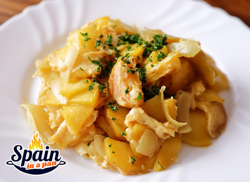 Spanish scrambled potatoes on a white ceramic plate.