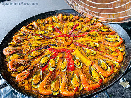 Spanish seafood paella in a pan.