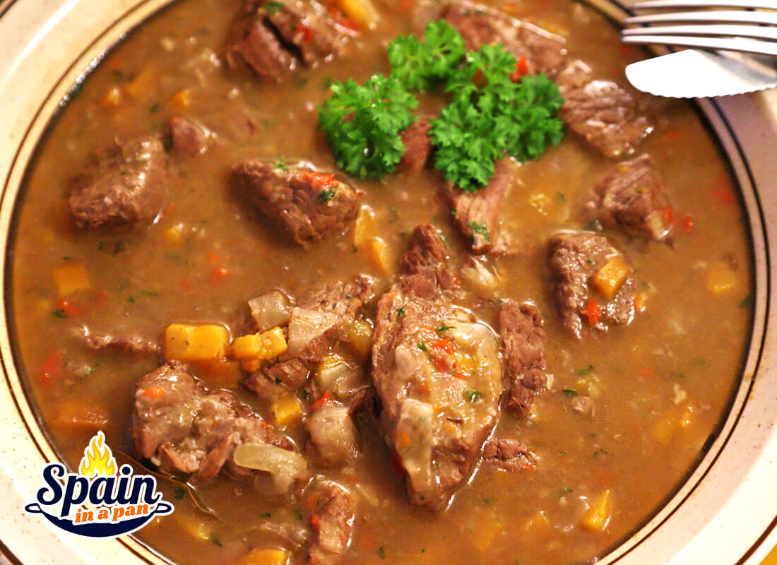 Spanish spicy beef stew on a plate.