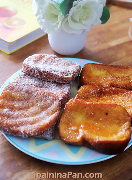 Spanish honey torrijas on a decorative serving plate.
