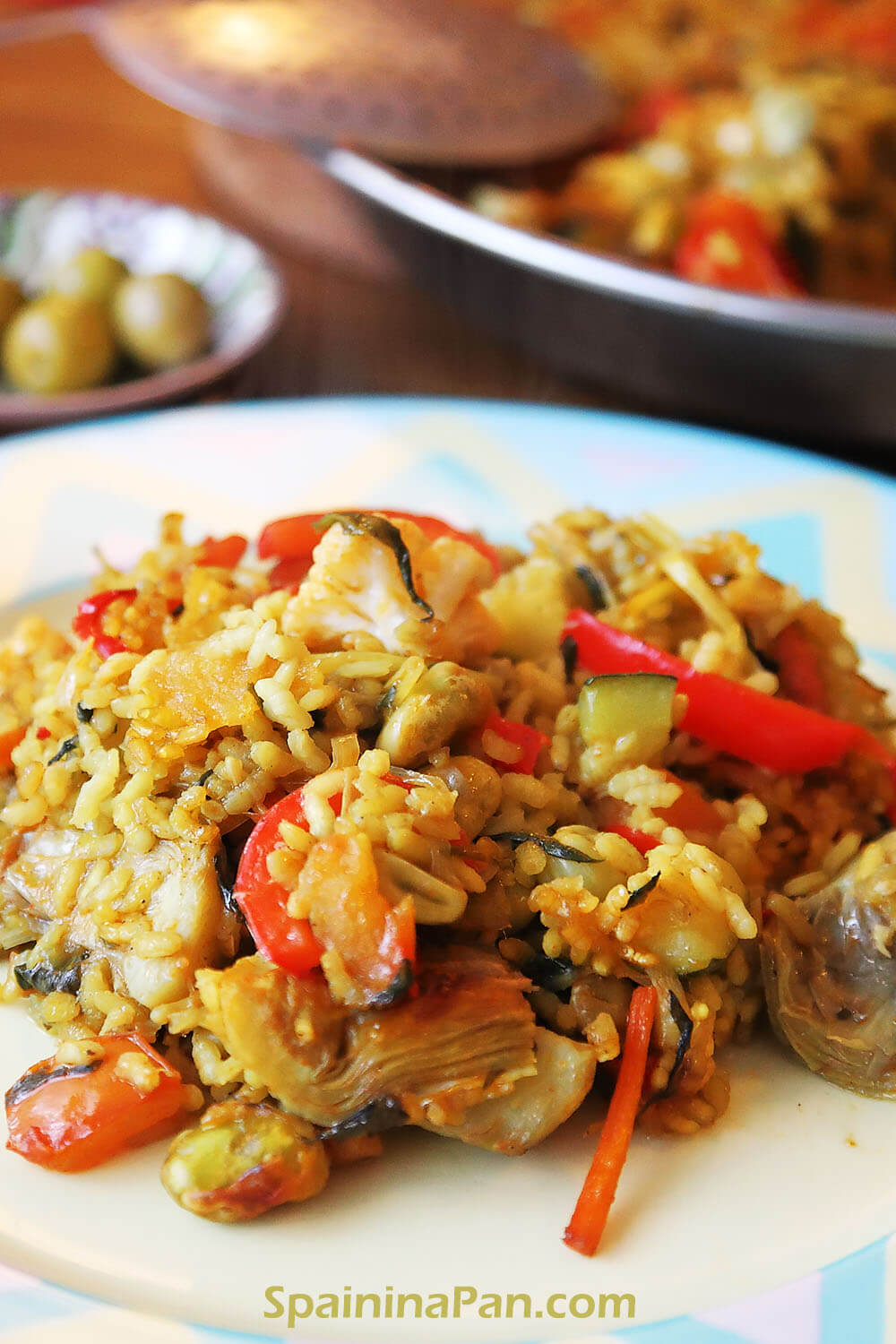 Vegetables paella on a decorative plate.