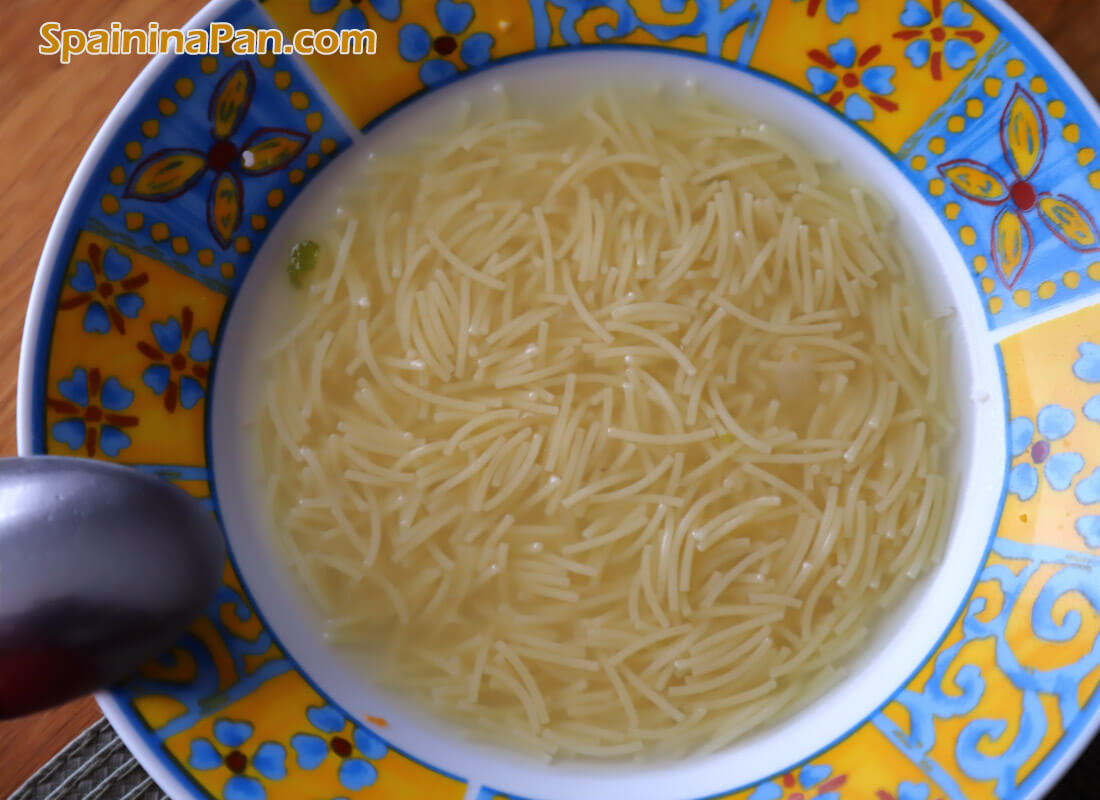 Vermicelli soup in a bowl from a Madrilenian cocido stew.